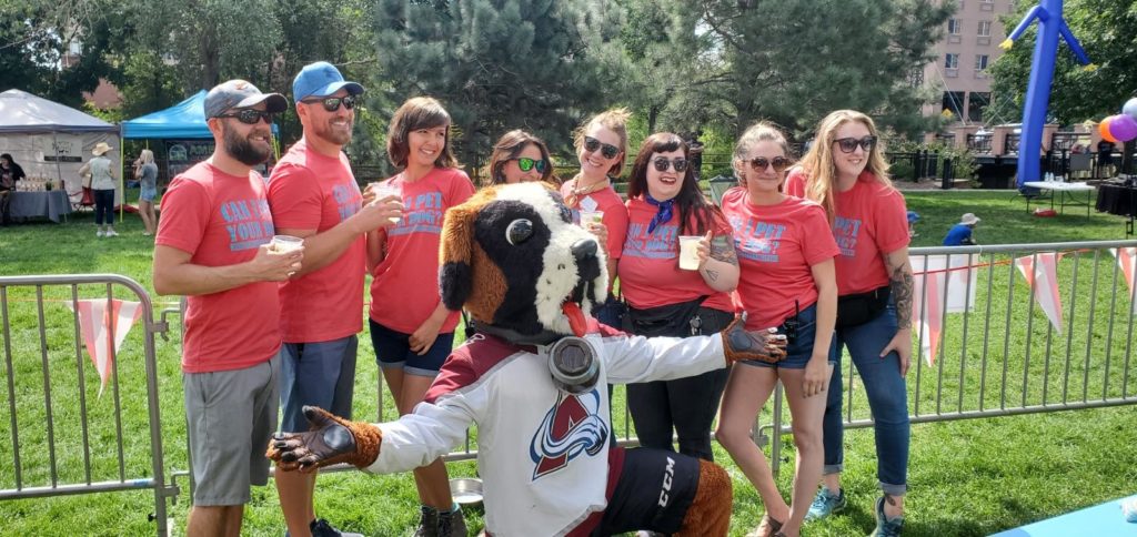 People with mascot at Toby's Pet Parade